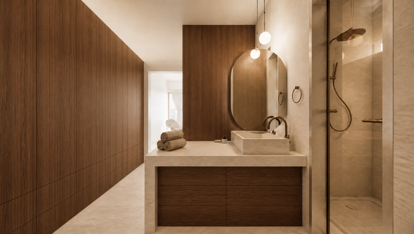 Baño y vestidor de Casa Rodbal con espejo oval, regadera de piedra y carpintería continua